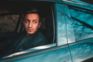 Guy Looking Out Through Open Car Window