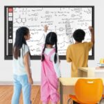 students write something on interactive flat panel display