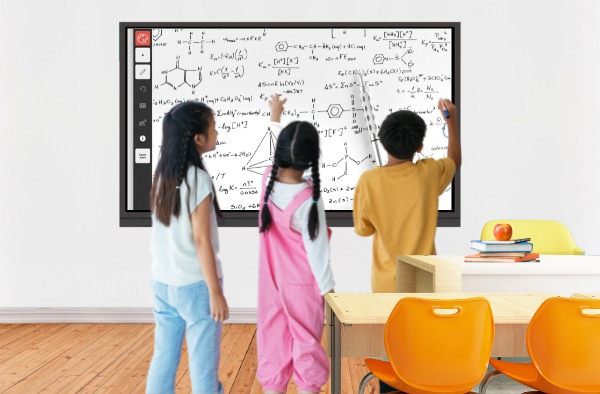 students write something on interactive flat panel display