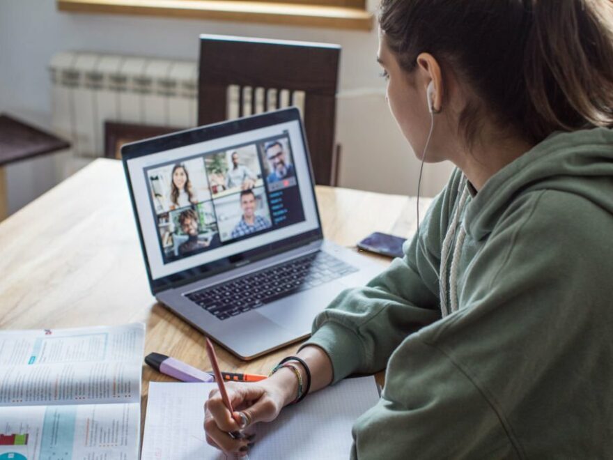 Young women at home during pandemic isolation learning