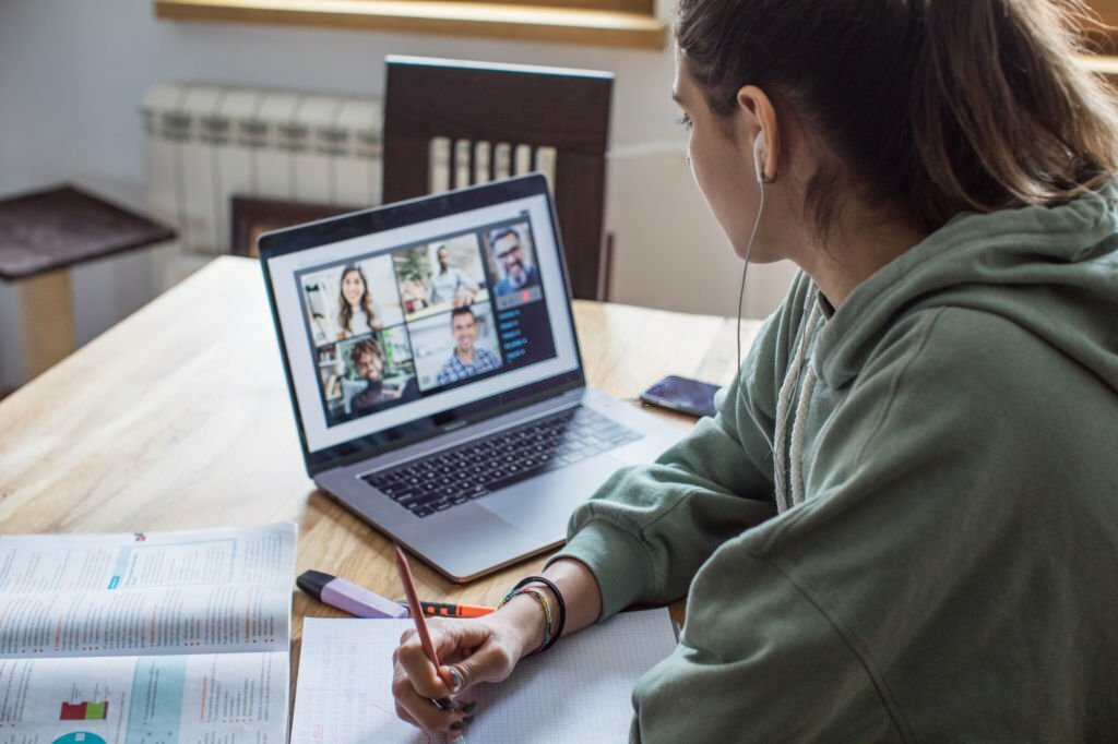 Young women at home during pandemic isolation learning