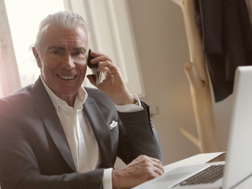 old man talking on phone