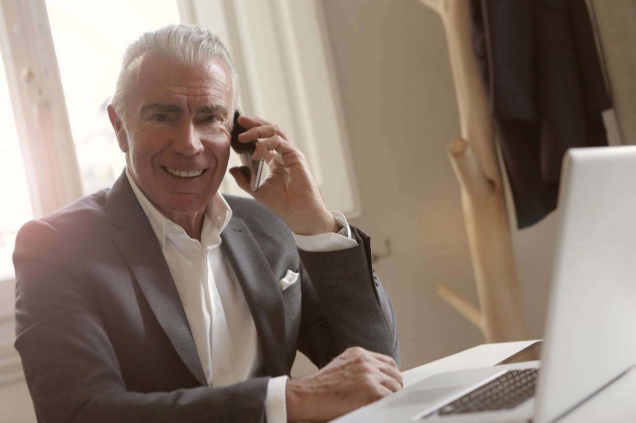 old man talking on phone