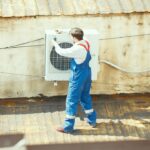 HVAC professional working on a air source heat pumps maintenance.