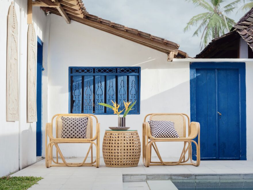 a chair and table next to a pool