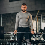 Strong man exercising at the gym