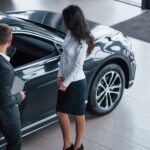 front-part-car-female-customer-modern-stylish-bearded-businessman-automobile-saloon_146671-16015