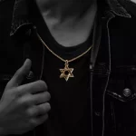 22K GOLD STAR OF DAVID PENDANT.