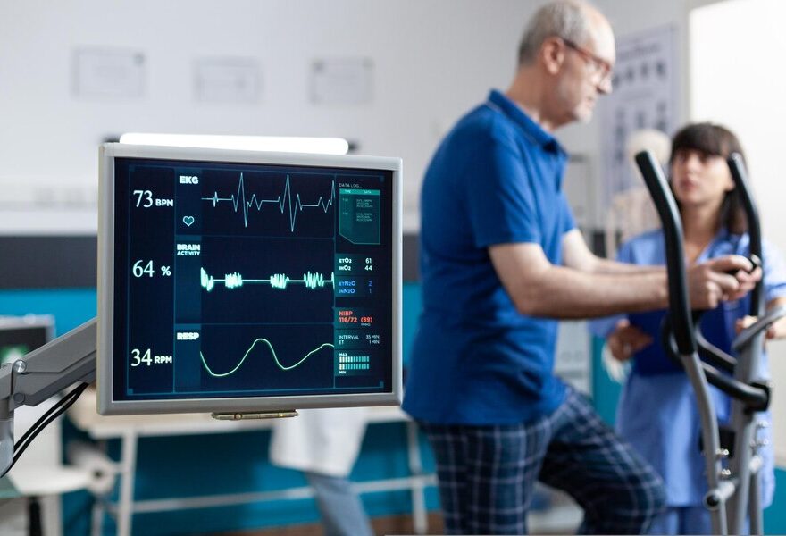 close-up-heart-rate-monitor-measuring-heartbeat-patient-doing-gymnastics-physical-recovery-retired-man-using-sport-equipment-exercise-physiotherapy-strength_