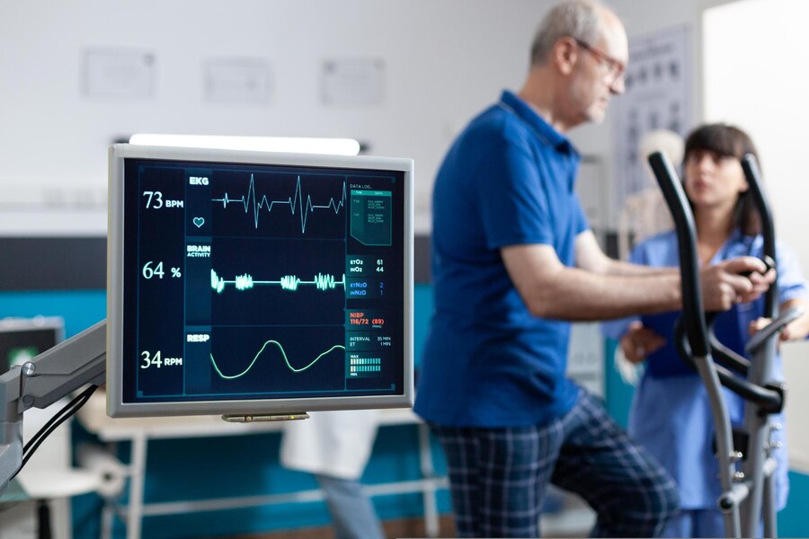 close-up-heart-rate-monitor-measuring-heartbeat-patient-doing-gymnastics-physical-recovery-retired-man-using-sport-equipment-exercise-physiotherapy-strength_