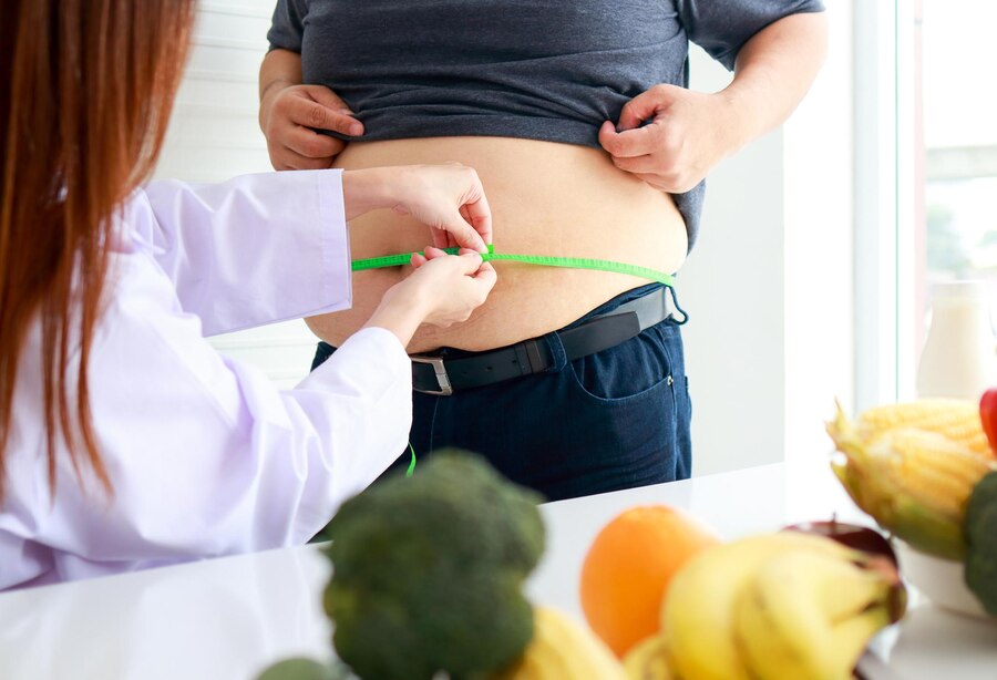 female-doctor-nutritionist-checks-health-obese-person-using-tape-measure-around-waist-obese-man-weight-loss-concept-medical-services-hospitals