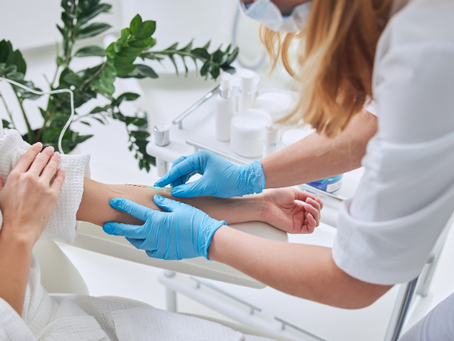 A nurse is preparing a patient for IV therapy.